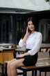 © tiniroma - Portrait of thai adult office girl calling smart phone