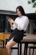 © tiniroma - Portrait of thai adult office girl using her smart phone