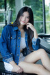 © tiniroma - Portrait of thai adult beautiful girl blue jeans relax and smile