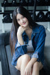 © tiniroma - Portrait of thai adult beautiful girl blue jeans relax and smile