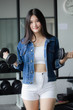 © tiniroma - Portrait of thai adult beautiful girl blue jeans in fitness relax and smile