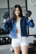 © tiniroma - Portrait of thai adult beautiful girl blue jeans in fitness relax and smile