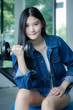 © tiniroma - Portrait of thai adult beautiful girl blue jeans in fitness relax and smile