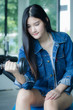© tiniroma - Portrait of thai adult beautiful girl blue jeans in fitness relax and smile