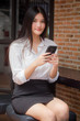 © tiniroma - Portrait of thai adult uniform office girl calling smart phone