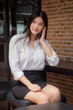 © tiniroma - Portrait of thai adult uniform office girl calling smart phone