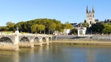 The Verdun Bridge In Angers (France) Is A Bridge With Masonry Vaults. It Is The Oldest Passage From One Side Of The Maine River To The Other. In The Background, There Is The Cathedral Of Angers.