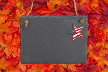 Autumn Time In The USA With A Chalkboard With A Retro Stars And Strips Star And Fall Leaves
