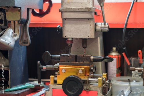 Fotografie, Obraz Key copying machine for keys duplicating work in the locksmiths workshop