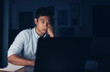 © mavoimages - Tired Asian businessman working on a laptop late at night