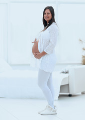 Poster - happy pregnant woman holding Cup of cocoa.