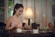 © SHUTTER DIN - Young asian girl in evening dress dinner under candlelight to night special