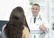 © ASDF - Handsome doctor talking with his patient