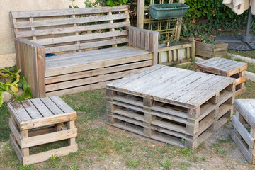 vintage wooden recycled palets make table and bench in house garden