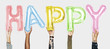 © Rawpixel.com - Hands showing happy balloons word
