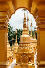 Golden arch gates and Thai pagoda of Wat Pasawangboon, Saraburi