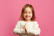 © Ilshat - Little girl folded her hands in palms, closed eyes, prays or makes a wish, wants something very much.