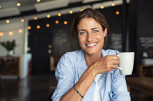 Smiling Mature Woman Drinking Coffee