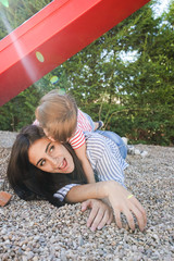 Wall Mural - Mom and daugther having fun at the park