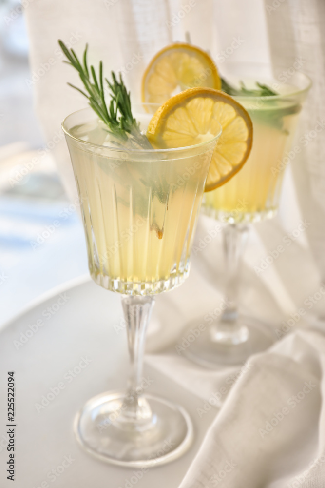 Glasses with delicious summer cocktail on windowsill