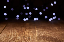 Close Up View Of Wooden Tabletop And Defocused Bokeh Lights Backdrop