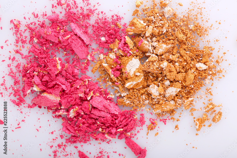 Crushed makeup powder on white background