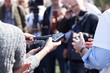 © wellphoto - Reporters making media interview during press conference