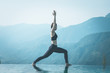 © 220 Selfmade studio - Beautiful Attractive Asian woman practice yoga Warrior I or Virabhadrasana Pose on the pool above the Mountain peak in the morning in front of beautiful nature views in SAPA vietnam