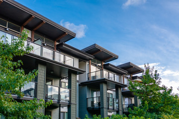 Poster - Top of residential building on blue sky background