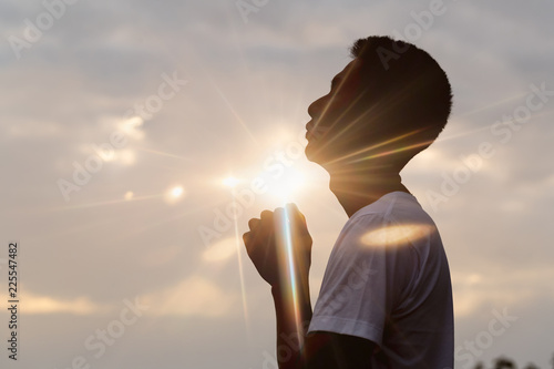 Fotografie, Obraz Silhouette of christian man hand praying,spirituality and religion,man praying to god
