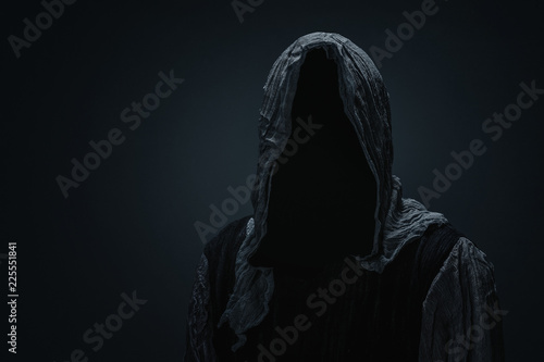 Fotografía Silhouette of Grim Reaper over dark gray background with copy space