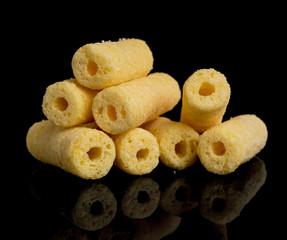 Wall Mural - Corn sticks on a black background