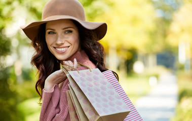 Wall Mural - Beautiful young woman with shopping bags