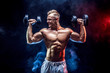 © zamuruev - Handsome bodybuilder doing Exercise for the shoulder muscles, deltoid with dumbbell. Studio shot. Smoke.