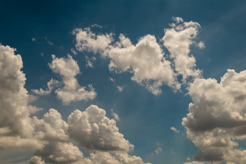 deep blue sky and white cloud background.