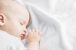 Cute sleeping baby in the bed