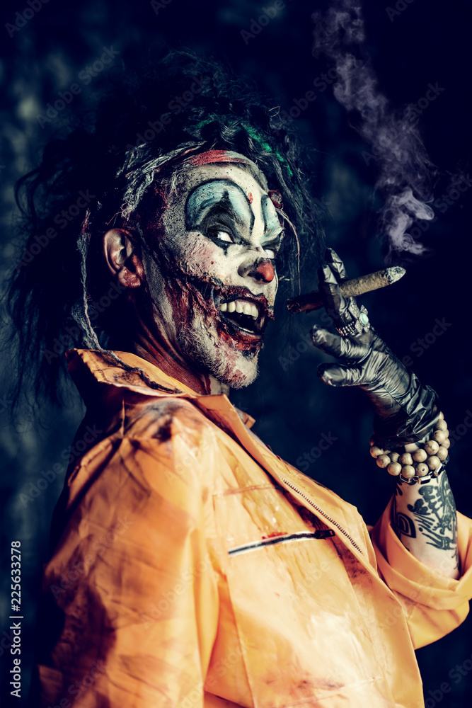 clown smoking cigarette clown smoking cigar Stock Photo