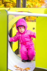 Little cute girl playing on the Playground