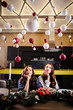 © cherry_d - Pretty twins young women together in a kitchen room, casual home style, new year and christmas decorations
