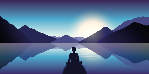 Wall Mural - person enjoy the silence at lake with mountain view in the dusk