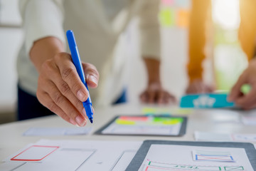 Creative Web Designer planning application and developing template layout, framework for mobile phone. User experience (UX) concept.