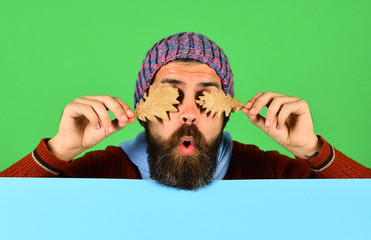 Poster - Hipster with beard and hidden sight wears warm clothes.