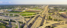 Panorama Horizontal Aerial View Massive Highway Intersection, Stack Interchange Blue Sky In Houston, Texas, USA. Elevated Road Junction Overpass, Five-level Freeway Carry Heavy Rush Hour Traffic