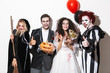 © Drobot Dean - Group of excited friends dressed in scary costumes