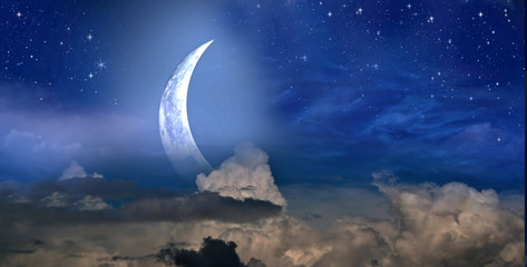 stars, moon and cumulonimbus in the night sky
