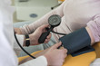 © LStockStudio - Doctor Measuring Blood Pressure