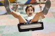 © Westend61 - Portrait of screaming little girl having fun on a swing