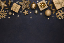 Golden Snowflakes, Gifts, Christmas Balls And Stars On Dark Background