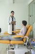 © LStockStudio - A Woman Physician Talking With Her Patient