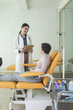 © LStockStudio - A Woman Physician Talking With Her Patient